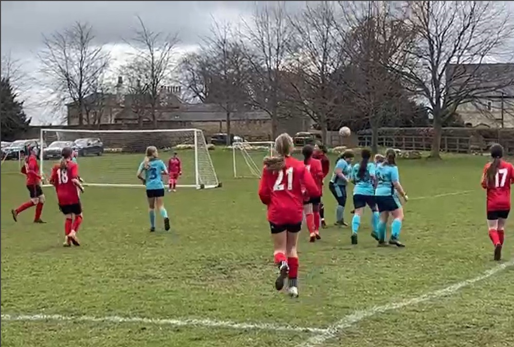 Photo of girls playing football
